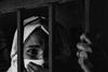 grayscale-photography-of-woman-inside-jail-2307045.jpg