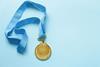 pp8-11_Aug2024_Profile_gold-medal-with-ribbon-2023-11-27-04-55-46-utc