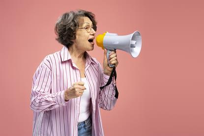 pp39_Nov2024_Menopause_senior-woman-wearing-holding-megaphone-talking-an-2024-01-08-22-59-34-utc