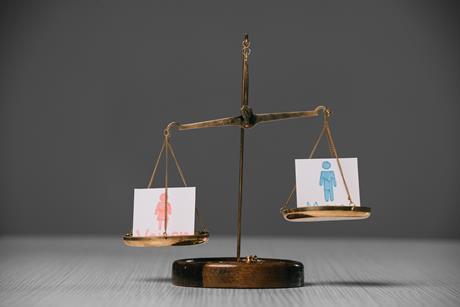 pp28_April2024_WAPlus_male-and-female-symbols-on-scales-on-wooden-table-2023-11-27-05-30-49