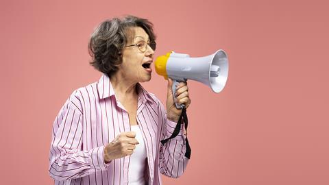 pp39_Nov2024_Menopause_senior-woman-wearing-holding-megaphone-talking-an-2024-01-08-22-59-34-utc