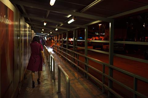 woman walking alone at night